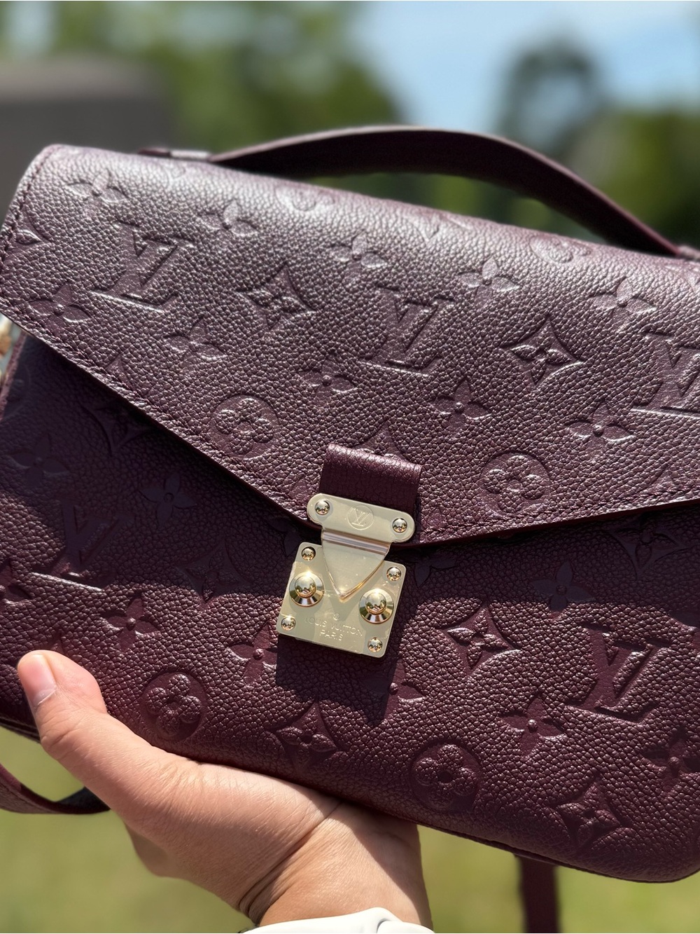 Louis Vuitton Pochette Metis Empreinte in Wine